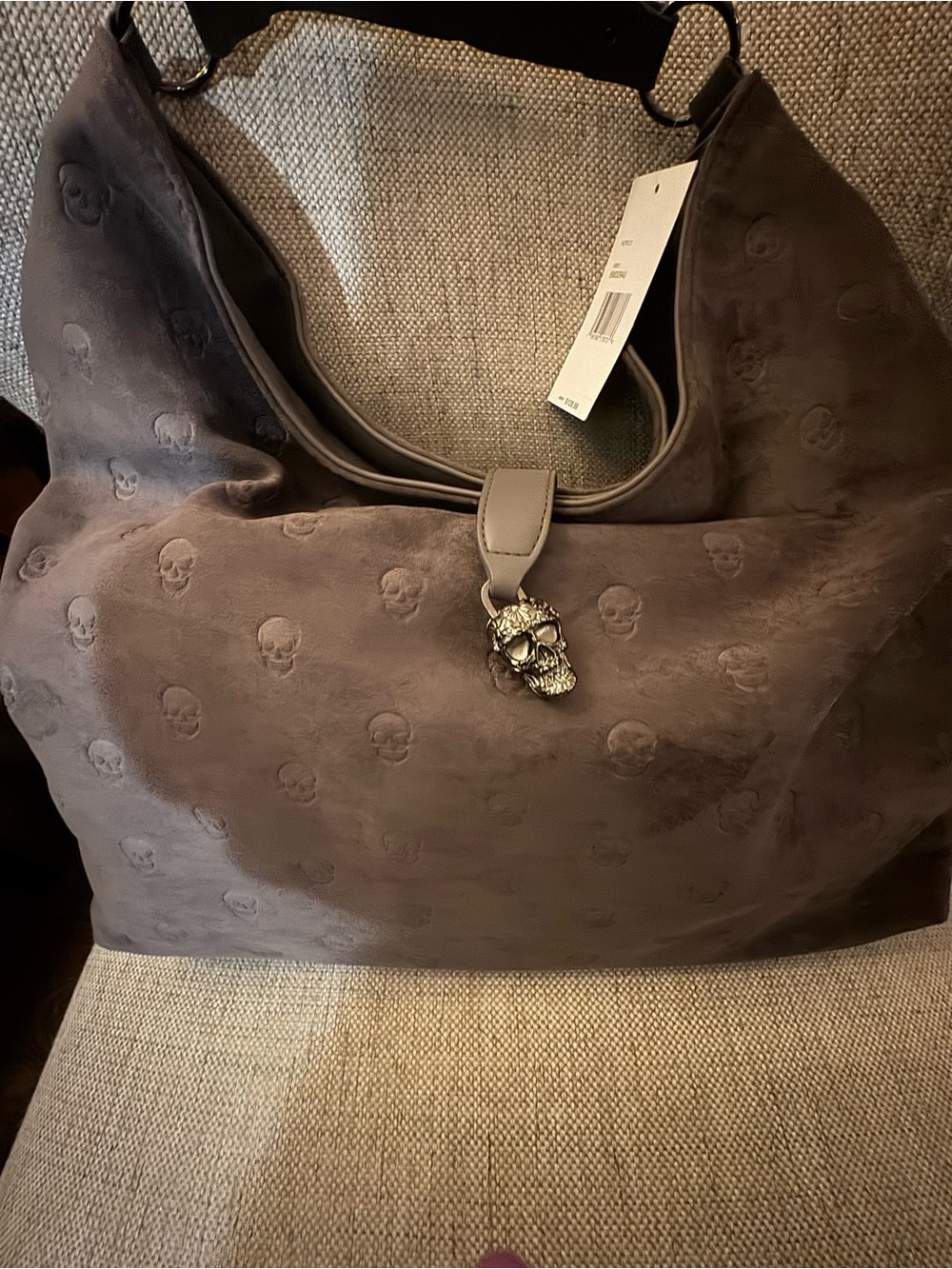 Gray Skull-Embossed Hobo Bag with Decorative Skull Charm
